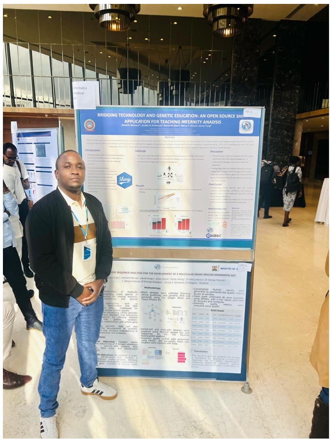 David Kiragu standing beside his mounted poster